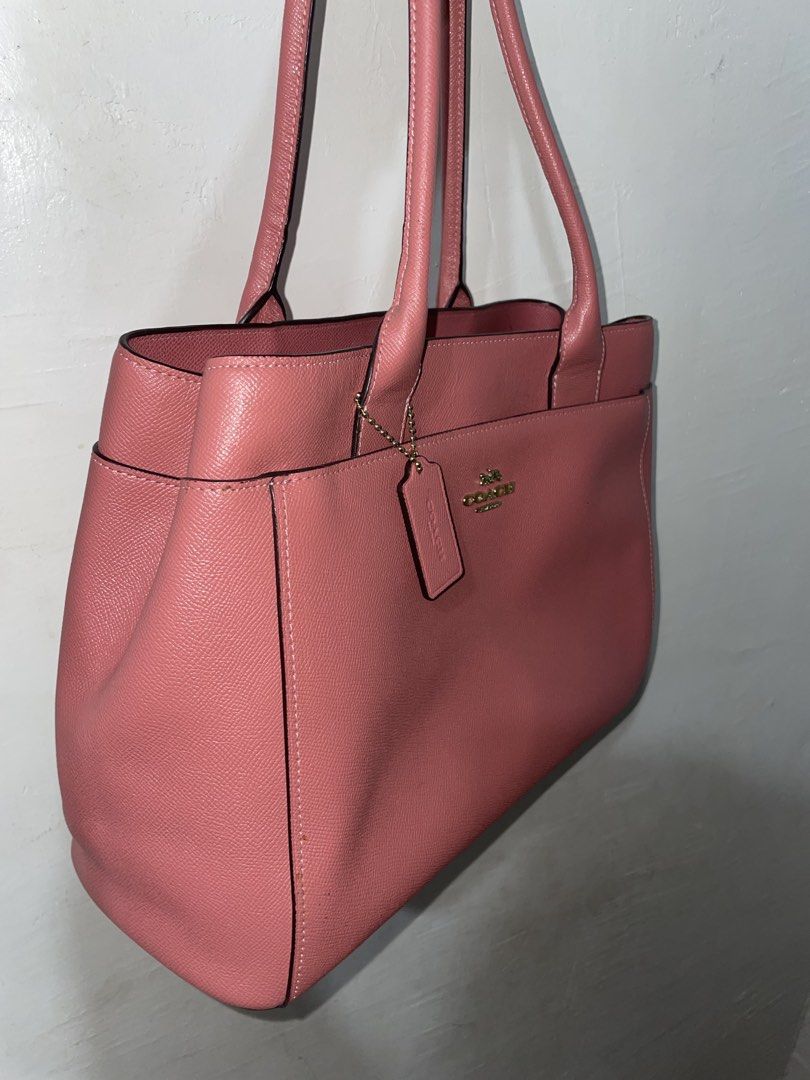 Coach Casey Crossgrain Pink Leather Bag (Category: Luxury Bags & Wallets) located in Manila. Submitted by earlonashow (Listing ID 1440427826, Image 2). Description: - Lovely pink Coach tote bag - Made with textured leather - Main zippered compartment - Interior pockets for organization - Four protective metal feet on the bottom - Interior lining shows some wear - Ideal for everyday use.