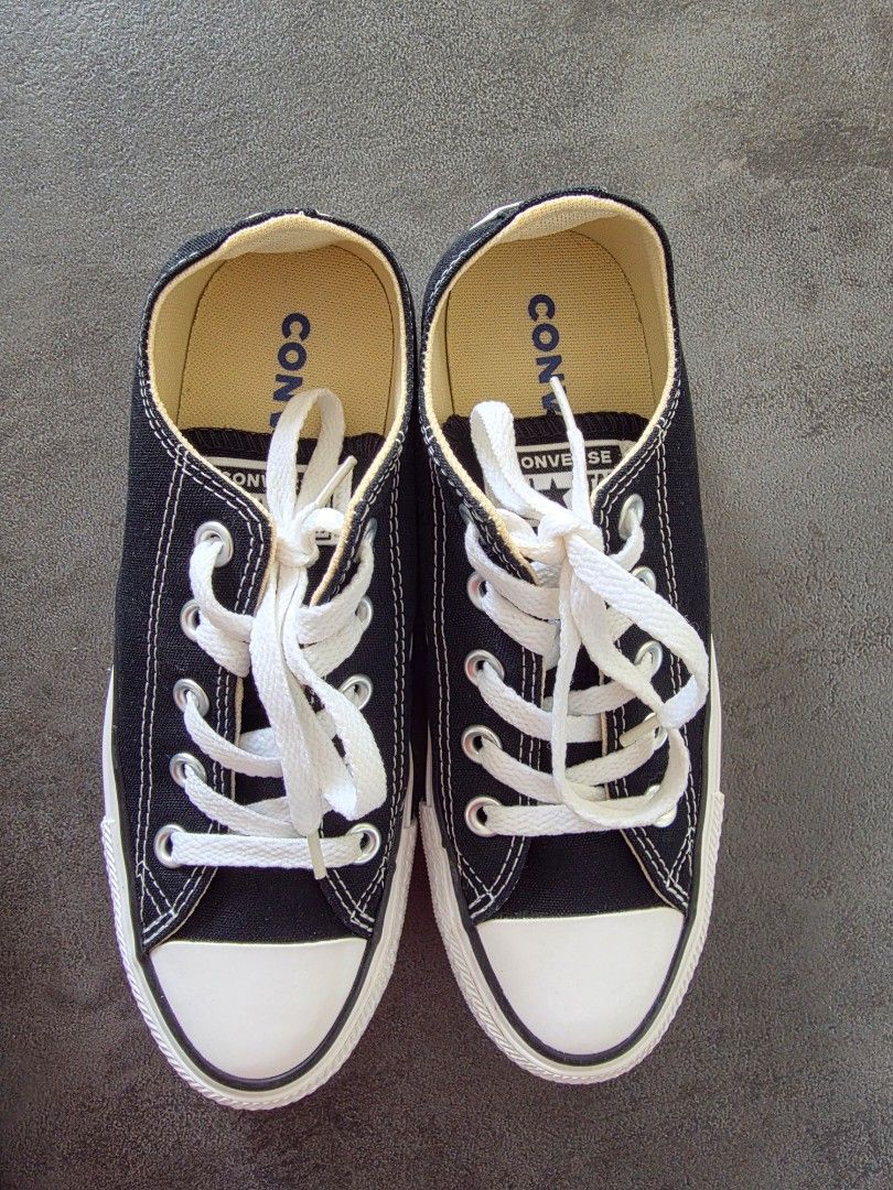 Converse All Star Ox Black Sneakers (Category: Sneakers) located in Paranaque City. Submitted by mark.ortigas (Listing ID 1440398648, Image 1). Description: - Classic black Converse low-tops - Durable canvas upper - White laces and signature toe cap - Sturdy rubber sole - Includes original box - Ideal for everyday style and comfort.