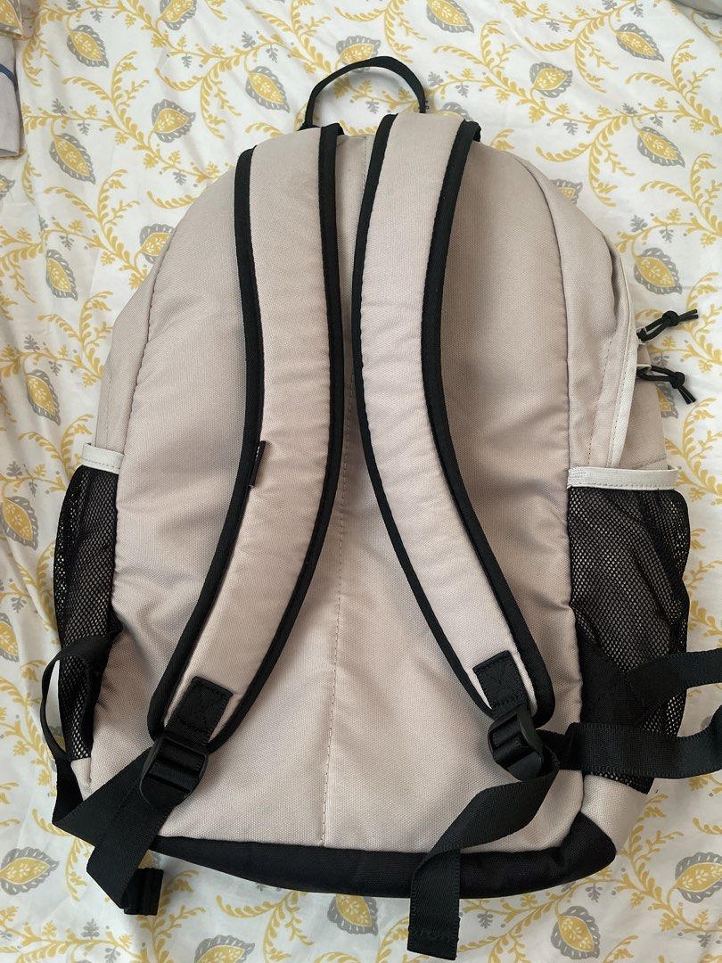 Converse Backpack Beige with Black Accents (Category: Backpacks) located in Quezon City. Submitted by sabrinaxdc (Listing ID 1440407850, Image 2). Description: - Beige Converse backpack - Black trim accents - Mesh side pockets for water bottles or essentials - Elastic bungee cord detail on the front - Adjustable padded straps for maximum comfort - Ample interior space - Ideal for school, work, or everyday adventures.