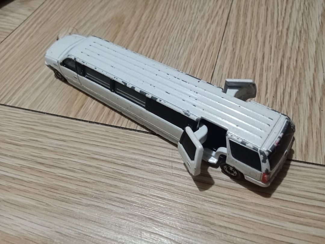 Diecast Tomica Cadillac Escalade (Category: Vehicle & Diecast Models) located in Bocaue. Submitted by marajapansurplus (Listing ID 1440499739, Image 2). Description: - Selling as it is - Japan sourced item - diecast Tomica Cadillac - Side doors open - Shows some paint wear and scuffs from play - Great for collectors - Fun for display or play.