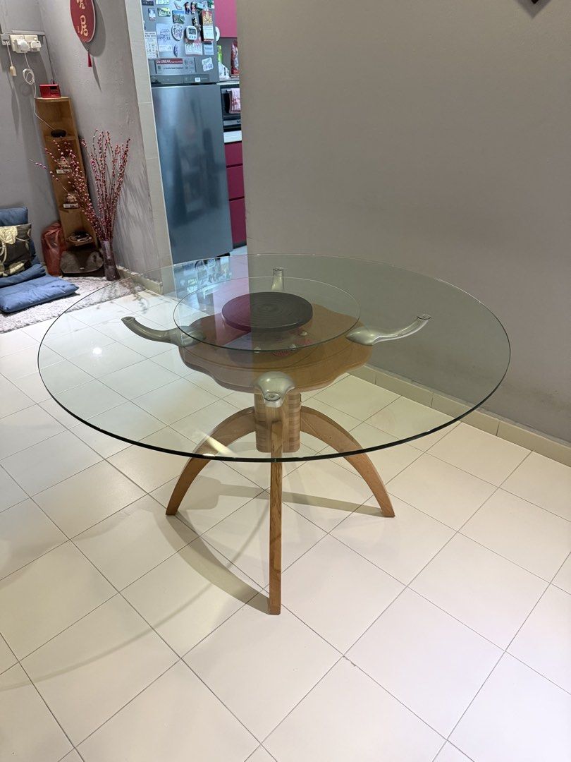 Dining table (Category: Tables & Sets) located in Singapore. Submitted by lollipo1996 (Listing ID 1440520970, Image 1). Description: Table dimension: 1.2m diameter, 74cm height. Accept cash only and need to carry yourself. Comes with a glass rotating plate in the middle .