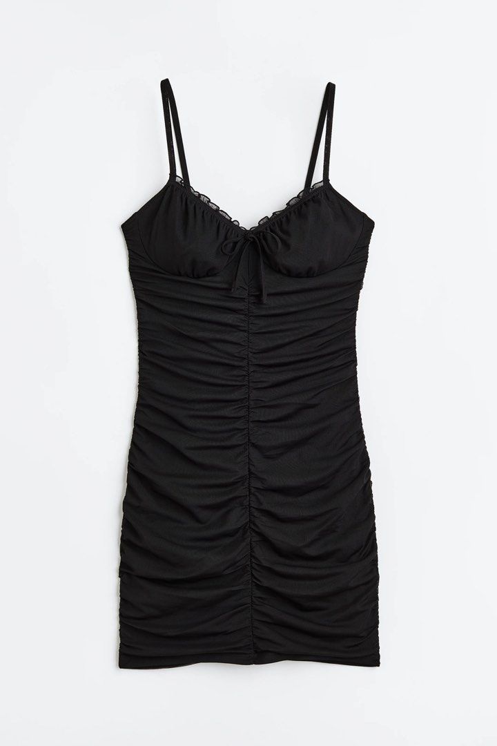 Divided H&M Black Ruched Mini Dress (Category: Dresses) located in Cebu City. Submitted by hazelcris (Listing ID 1440408665, Image 1). Description: - Divided black ruched mini dress - Adjustable spaghetti straps - Tie detail at the bust - Flattering ruched silhouette - Ideal for nights out or parties - Size XXS.