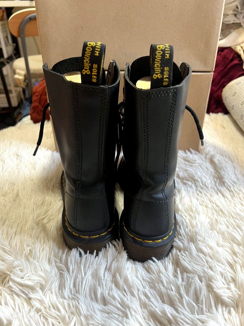 Dr. Martens Black Leather Lace-Up Boots (Category: Boots) located in Quezon City. Submitted by thrifterella (Listing ID 1440480371, Image 2). Description: Classic black leather Dr. Martens boots 🥾 Genuine Leather Color: Black w/ Iconic yellow stitching Size: 22.5 cm Conditions: preloved no box Selling Price: ₱2,500 (Slightly negotiable).