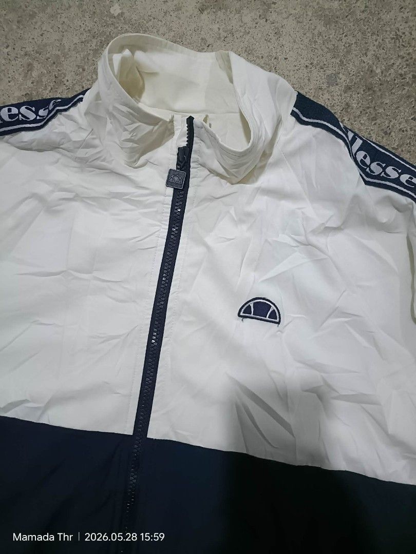 Ellesse heritage side tape jacket (Category: Coats, Jackets and Outerwear) located in Alburquerque. Submitted by ayrelieonlineshop (Listing ID 1440546705, Image 3). Description: ellesse heritage side tape jacket size 100 (large) dimes. W-22.5. L-28 excellent condition no pinhole or punit.