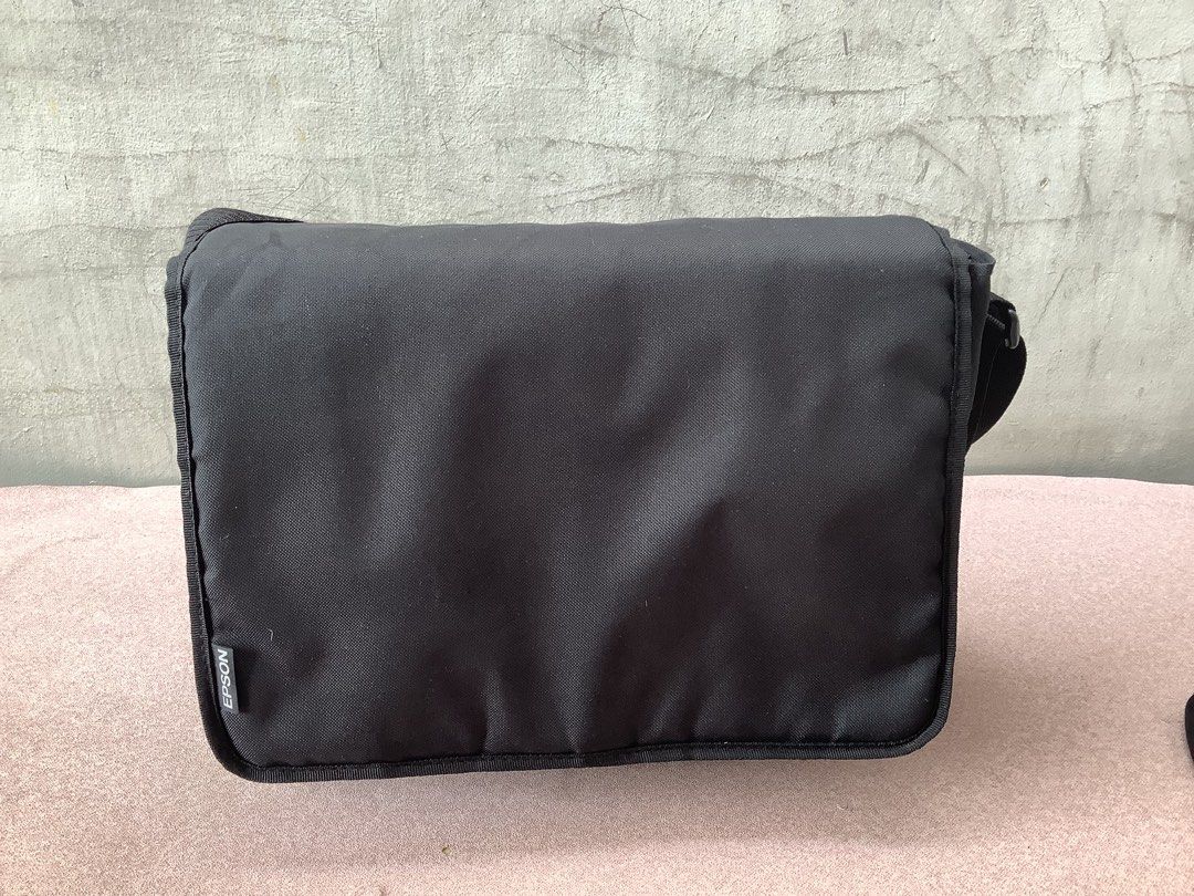 Epson Black LCD Projector Bag (Category: Projectors) located in Paranaque City. Submitted by seb_trading (Listing ID 1440458942, Image 1). Description: - Durable black messenger bag - Adjustable strap for comfortable wear - Features Epson logo on the front flap - Ideal also for carrying small essentials or a camera - Clean and simple design - last price - Paranaque area.