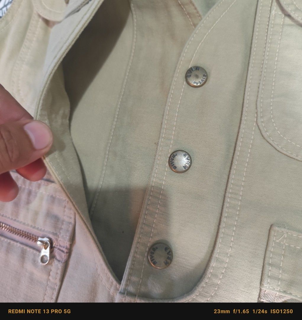 EVENRIVER Khaki Utility/Multi Pocket Vest Size M (Category: Vests) located in Manila. Submitted by buyybustt (Listing ID 1440475623, Image 3). Description: - Khaki utility vest by EVENRIVER - Size: Medium (M) - Multiple pockets for storage - Some pockets feature secure zippers - Button front closure - Ideal for outdoor activities and casual wear - Convenient for carrying essentials -18x23 Super Good Condition and High Quality .