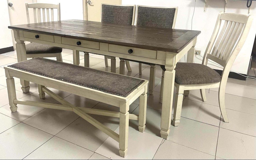 Farmhouse Dining Table, Chairs, and Bench Set (Category: Tables & Sets) located in Caloocan City. Submitted by bountycart (Listing ID 1440394587, Image 2). Description: - Farmhouse-style dining set - Includes: Wooden table (dark top, white base), 4 chairs with upholstered seats, 1 long bench - Rustic charm, fits various decor styles - Perfect for family meals and entertaining - Ready for a new home.