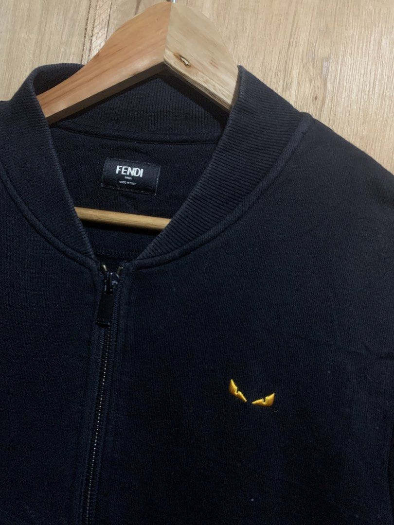 Fendi Black Bomber Jacket with Monster Eyes Logo (Category: Luxury Apparel) located in Manila. Submitted by haven_thrift (Listing ID 1440496408, Image 2). Description: - Black Fendi bomber jacket - Iconic monster eyes logo embroidered on chest - Full zip closure - Made in Italy - Ideal for Fendi enthusiasts.
