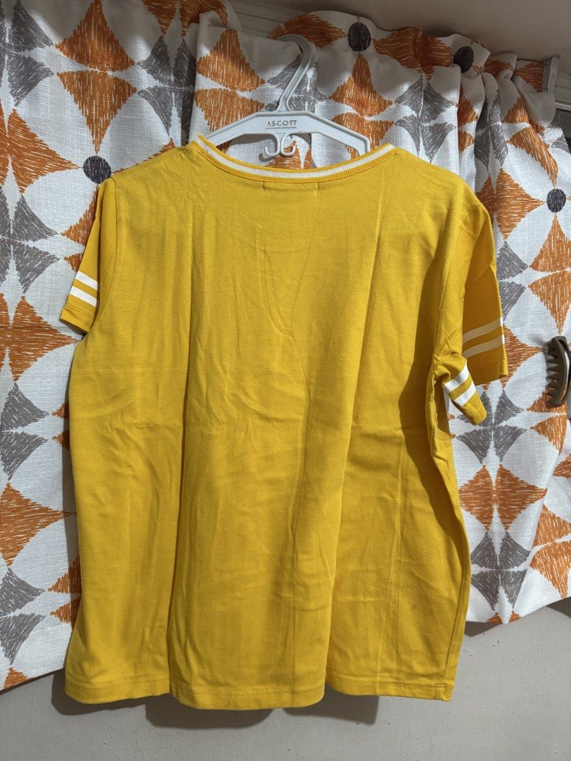 GTW URBAN Yellow #ROAR AS ONE Graphic Tee (Category: Shirts) located in Manila. Submitted by mxbeex (Listing ID 1440518376, Image 3). Description: - Vibrant yellow t-shirt with '#ROAR AS ONE' graphic print - Classic short sleeves featuring stylish white stripes - Comfortable crew neck with white trim detail - Made from a soft and breathable cotton blend - Perfect for everyday casual wear and showing your support.
