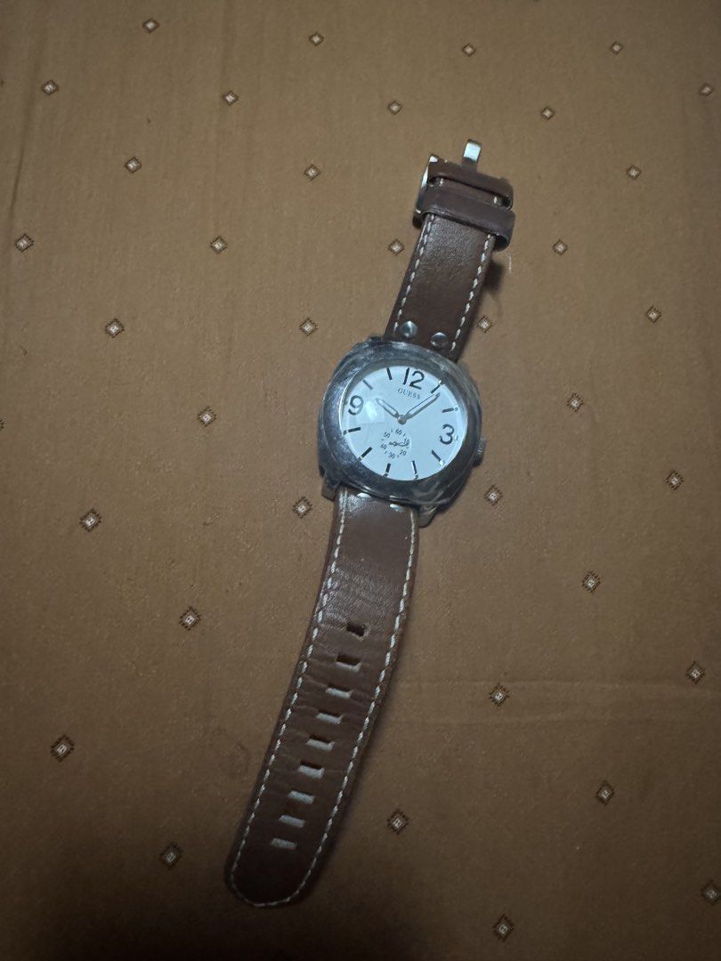 guess (Category: Women's Watches) located in Cainta. Submitted by simoun19 (Listing ID 1440488715, Image 3). Description: Clean and classy silver tone watch with brown leather strap — perfect for casual or smart outfits. Features a unique dial design with day/date display that gives a premium modern look. ✔️ Good condition ✔️ Leather strap ✔️ Stylish minimalist design ✔️ Lightweight and comfortable to wear ✔️ Perfect for everyday use No battery i