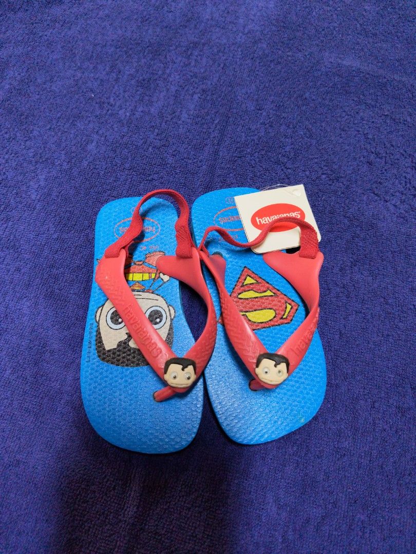 Havaianas Superman Flip Flops with Strap - Size 22 (Category: Babies & Kids Fashion) located in Singapore. Submitted by claraofficial (Listing ID 1440497566, Image 1). Description: - Cute Havaianas flip flops for kids - Fun Superman design - Vibrant blue and red colours - Secure strap for active play - Perfect for beach or pool - Size 22 - Comes with original tag.