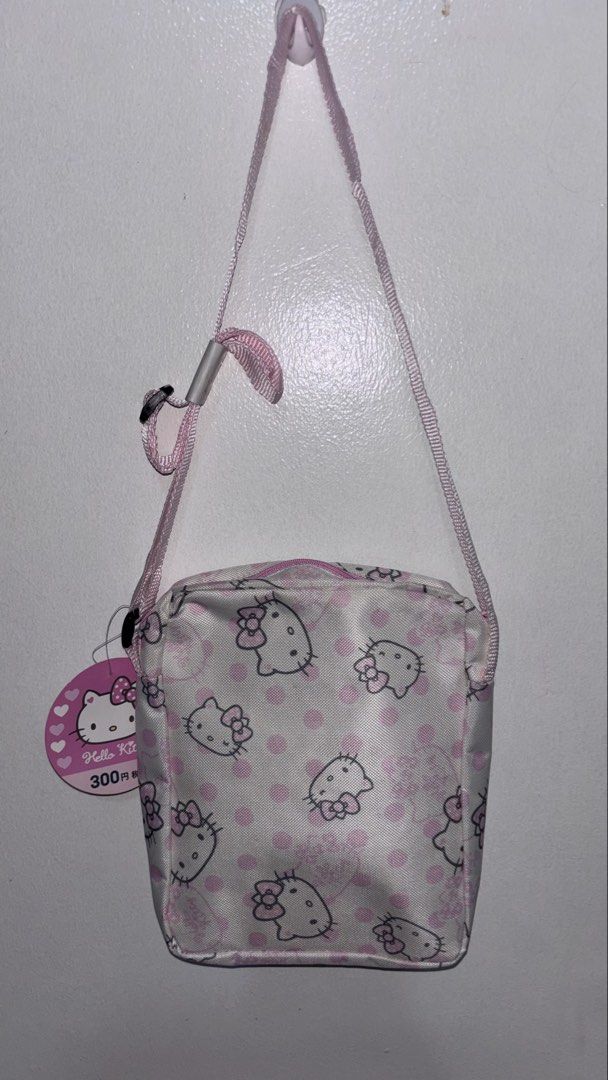 Hello Kitty Cross Body Bag (Category: Cross-body Bags) located in Pasig City. Submitted by Atv26 (Listing ID 1440448111, Image 1). Description: Hello Kitty Sanrio Cross Body Bag Super Super Sale Pamigay Price May dumi sa strap see picture due to storage. Measure: Width 8 inches Length 8 1/2 inches 📌J&T Courier.