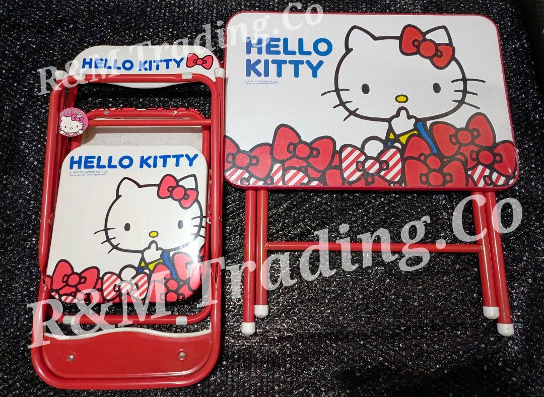 Hello Kitty Folding Table and Chair Set for Kids (Category: Kids Tables & Chairs) located in Pasig City. Submitted by artliam888 (Listing ID 1440575581, Image 1). Description: MALL PULL-OUT BRANDNEW AS-IS-WHERE-IS 1pc Table & 2pcs Chairs PRICE: 1,999 - Adorable Kitty folding table and chair set. - Perfect for drawing, playing, or eating. - Features a bright red frame with cute Kitty graphics and bows. - Folds flat for convenient storage. - Great 