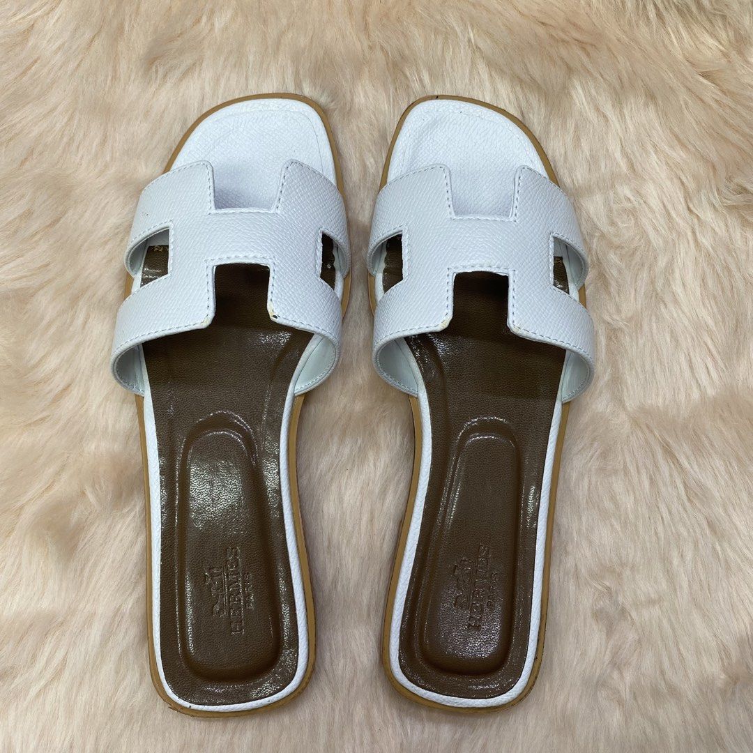 HERMES ORAN SLIPPER (WHITE) SIZE AVAILABLE (35-41) (Category: Slippers & Slides) located in San Juan City. Submitted by pattycollection113 (Listing ID 1440553052, Image 2). Description: HELLO WELCOME TO OUR SHOP our product is high quality and onhand. INCLUDES: BOX and PAPER BAG. AVAILABLE SIZE 35-41.