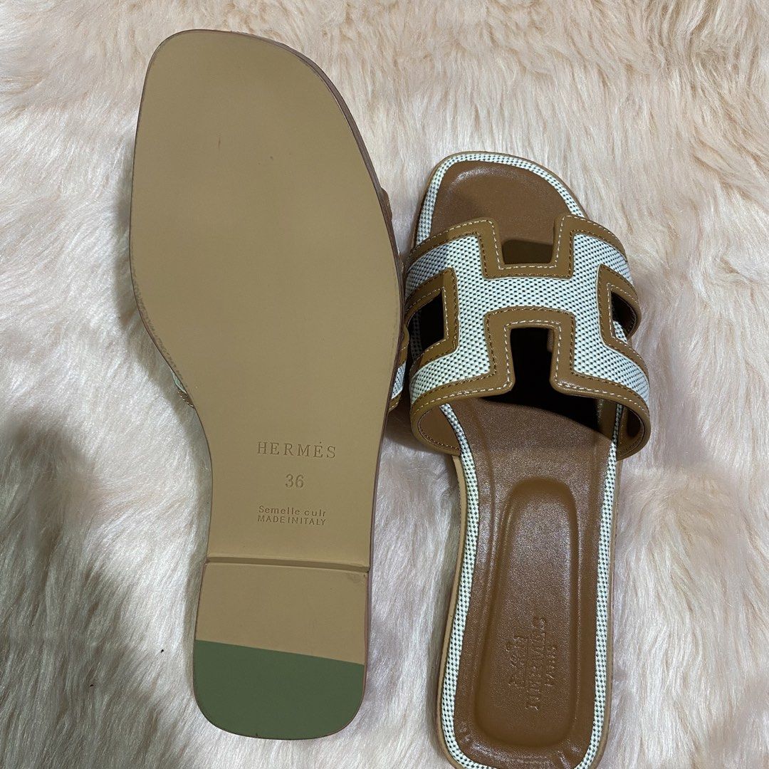 HERMES ORAN SLIPPER (TAN&WHITE) SIZE AVAILABLE (35-41) (Category: Flats & Sandals) located in San Juan City. Submitted by pattycollection113 (Listing ID 1440554331, Image 3). Description: HELLO WELCOME TO OUR SHOP our product is high quality and onhand. INCLUDES: BOX and PAPER BAG. AVAILABLE SIZE 35-41.