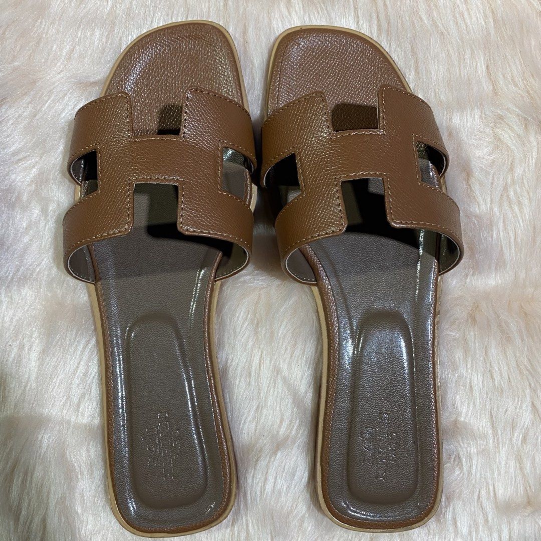 HERMES ORAN SLIPPER (TAN) SIZE AVAILABLE (35-41) (Category: Flats & Sandals) located in San Juan City. Submitted by pattycollection113 (Listing ID 1440554627, Image 2). Description: HELLO WELCOME TO OUR SHOP our product is high quality and onhand. INCLUDES: BOX and PAPER BAG. AVAILABLE SIZE 35-41.