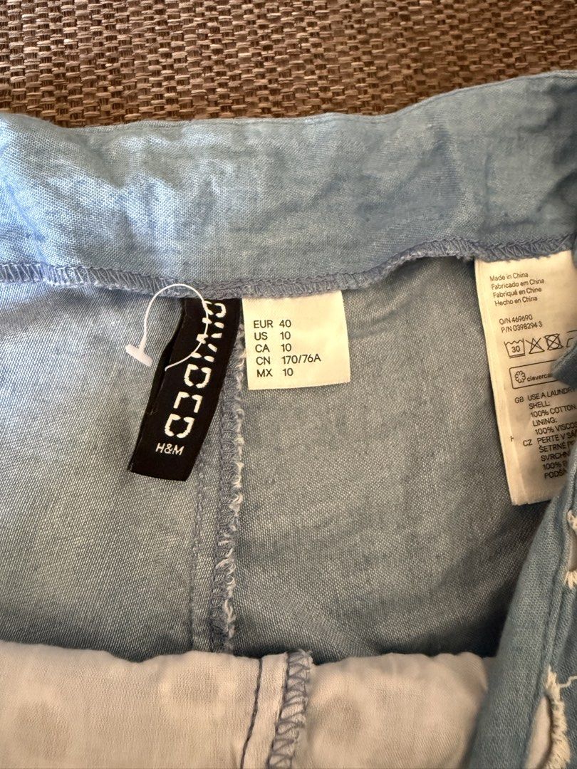 H&M Blue Eyelet Shorts Size 10 (Category: Shorts) located in Cebu City. Submitted by hazelcris (Listing ID 1440408501, Image 3). Description: - Brand: H&M - Color: Blue - Style: Shorts - Features: All-over eyelet pattern, scalloped hem - Occasion: Perfect for summer days - Versatility: Easy to pair with any top - Waist Size: 76cm.