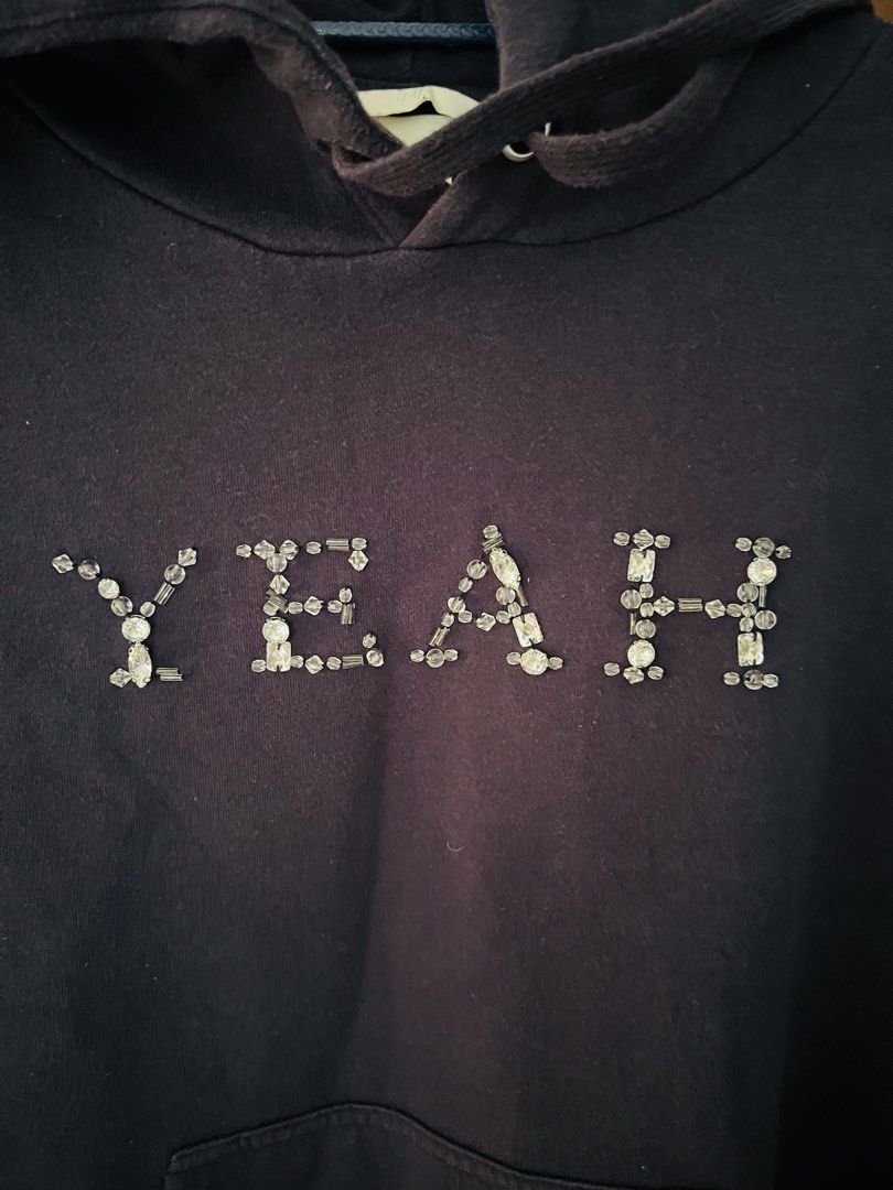 H&M Divided Oversized Rhinestone Graphic Hoodie. (Category: Coats, Jackets and Outerwear) located in Quezon City. Submitted by bfindsph_26 (Listing ID 1440427696, Image 2). Description: •H&M (Divided line)Design •Oversized •Front rhinestone/gem embellishment spelling out “YEAH”Features •Midweight cotton-blend fabric, drop shoulders, kangaroo pocket, and a wrapover hood. •Dark Navy / Vintage Black.