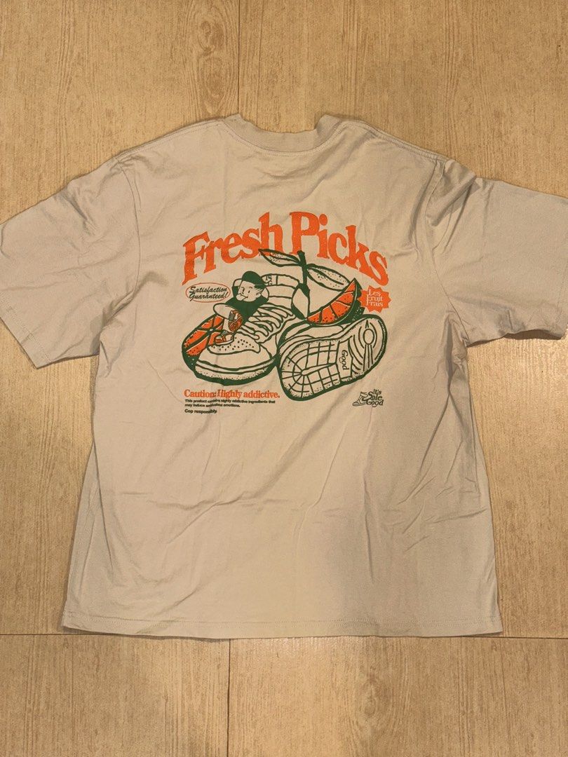ISG Fresh Picks Graphic T-Shirt (Category: Tshirts & Polo Shirts ) located in Santa Rosa. Submitted by ltvelasco (Listing ID 1440458922, Image 1). Description: - Eye-catching 'Fresh Picks' graphic tee - Features a cool cartoon character and sneakers design on the back - 'ISG' logo detail on the front left chest - Measurements: Length 76cm, Width 60cm (fits like a Large) - Ideal for everyday casual wear.