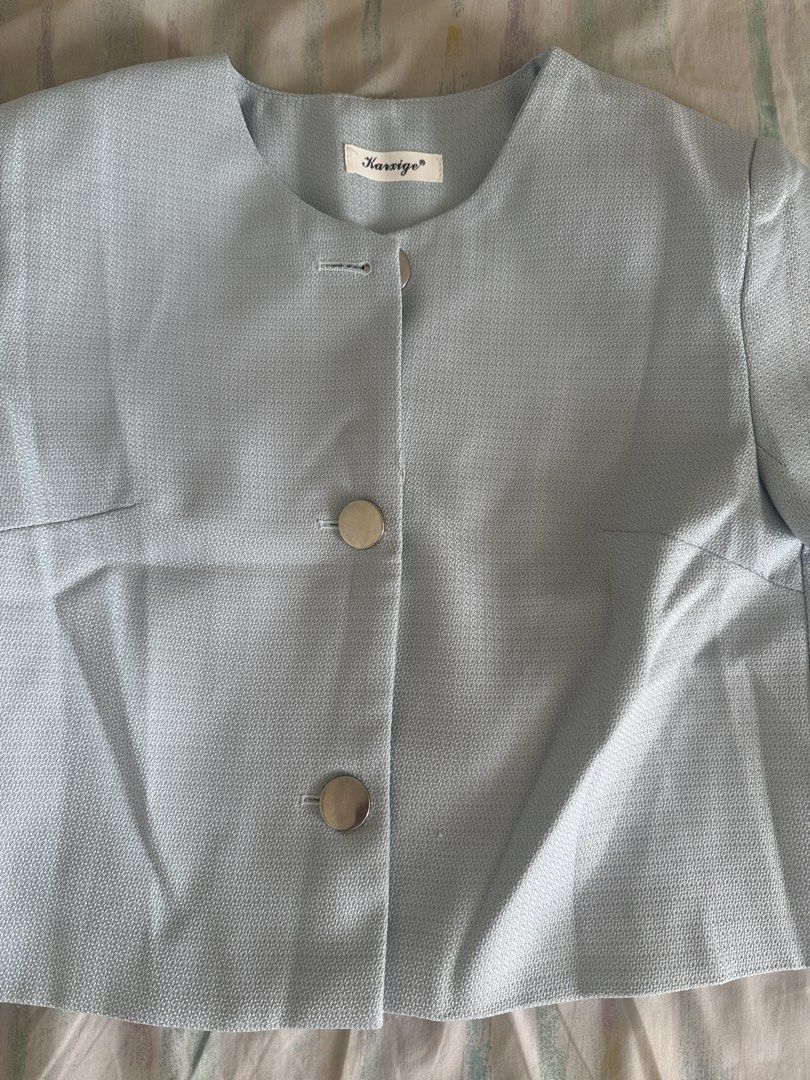 Karsige Light Blue Cropped Blazer with Silver Buttons (Category: Coats, Jackets and Outerwear) located in Paranaque City. Submitted by declutterwyae (Listing ID 1440437611, Image 2). Description: - Light blue cropped blazer from Karsige - Short sleeves - Three large silver buttons down the front - Round neckline - Textured fabric - Pairs well with high-waisted bottoms.