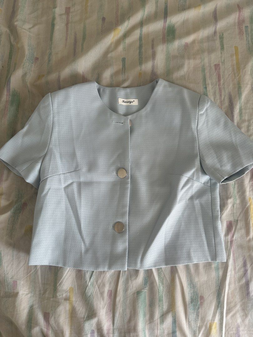 Karsige Light Blue Cropped Blazer with Silver Buttons (Category: Coats, Jackets and Outerwear) located in Paranaque City. Submitted by declutterwyae (Listing ID 1440437611, Image 1). Description: - Light blue cropped blazer from Karsige - Short sleeves - Three large silver buttons down the front - Round neckline - Textured fabric - Pairs well with high-waisted bottoms.