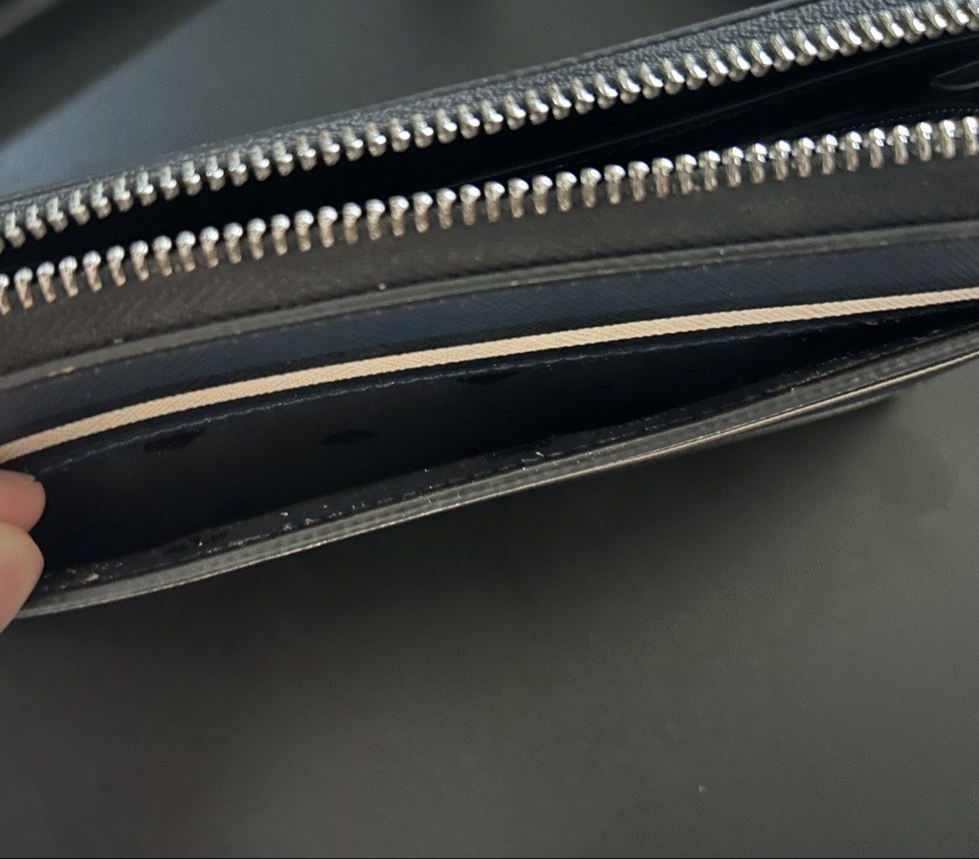Kate Spade Zip Around Wallet (Category: Wallets & Card holders) located in Quezon City. Submitted by bea30 (Listing ID 1440402792, Image 3). Description: - Authentic Kate Spade New York wallet - Secure zip-around closure - Ample card slots and compartments for organization - Minor signs of wear on exterior (as pictured) - Doesn’t come with dustbag or box.