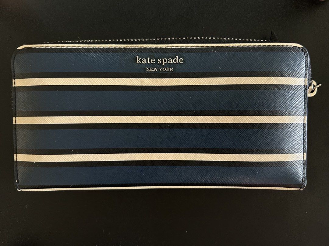 Kate Spade Zip Around Wallet (Category: Wallets & Card holders) located in Quezon City. Submitted by bea30 (Listing ID 1440402792, Image 1). Description: - Authentic Kate Spade New York wallet - Secure zip-around closure - Ample card slots and compartments for organization - Minor signs of wear on exterior (as pictured) - Doesn’t come with dustbag or box.