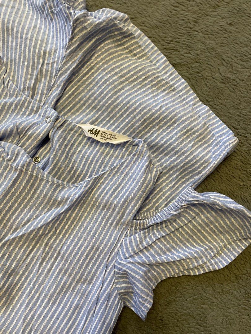 Kids Striped Cold-Shoulder Romper / Playsuit (Category: Babies & Kids Fashion) located in Ozamiz City. Submitted by eomygosh (Listing ID 1440319907, Image 1). Description: Name: Kids Striped Cold-Shoulder Romper / Playsuit Brand: H&M Color: Light Blue / White Vertical Stripes Size: EUR 140 / US 9-10Y (Fits 9 to 10 years old) Style: Casual summer romper featuring an elasticated waist, short legs, a button-closure keyhole back, and open cold-should