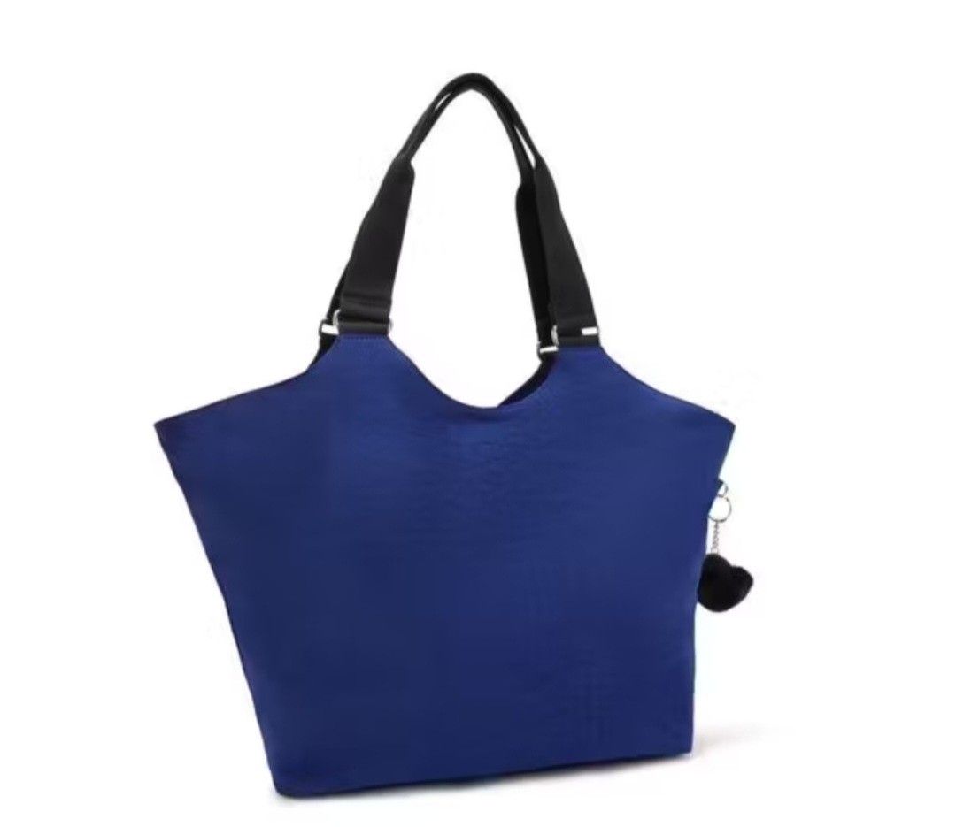 Kipling Cicely Tote Bag Rapid Navy (Category: Tote Bags) located in Davao. Submitted by jilly07 (Listing ID 1440565313, Image 3). Description: - Blue Kipling tote bag - Two front zip pockets - Main zip compartment - Internal smaller pockets for organization - Comes with signature Kipling monkey charm - Ideal for everyday use or travel USED ONLY ONCE TO TRY. In excellent condition, still looks new. NO FLAWS. Comes with tags and original packaging.