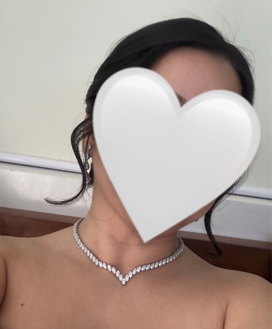 KLAD Necklace and Earrings Set (Category: Necklaces) located in Paranaque City. Submitted by roomcleanupph (Listing ID 1440432882, Image 3). Description: - Retail price was ₱7,298 - Worn once during wedding - Beautiful necklace and earrings set from KLAD - Features a V-shaped necklace with sparkling crystals - Includes matching drop earrings - Comes in its original box - Perfect for special occasions or as a gift.