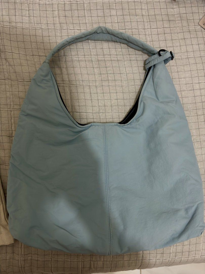 KNOWELL Shoulder Hobo Bag with Dust Bag (Category: Shoulder Bags) located in Candelaria. Submitted by preloveeedforless (Listing ID 1440519131, Image 3). Description: - Light blue padded shoulder bag from KNOWELL - Comes with original dust bag - Snap button closure inside - Adjustable strap hardware - Spacious interior - Ideal for everyday use Sells 1199 in Orange app, see attached photo for proof.