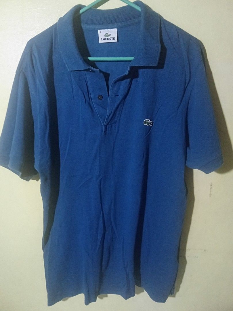 Lacoste Blue Polo Shirt Size 4 (Category: Tshirts & Polo Shirts ) located in Manila. Submitted by banisher_84 (Listing ID 1440508282, Image 1). Description: - Classic blue Lacoste polo shirt - Features iconic crocodile logo - Button-up neckline - Comfortable 100% cotton material - Ideal for casual or sporty outfits - Versatile: pairs easily with jeans or shorts.