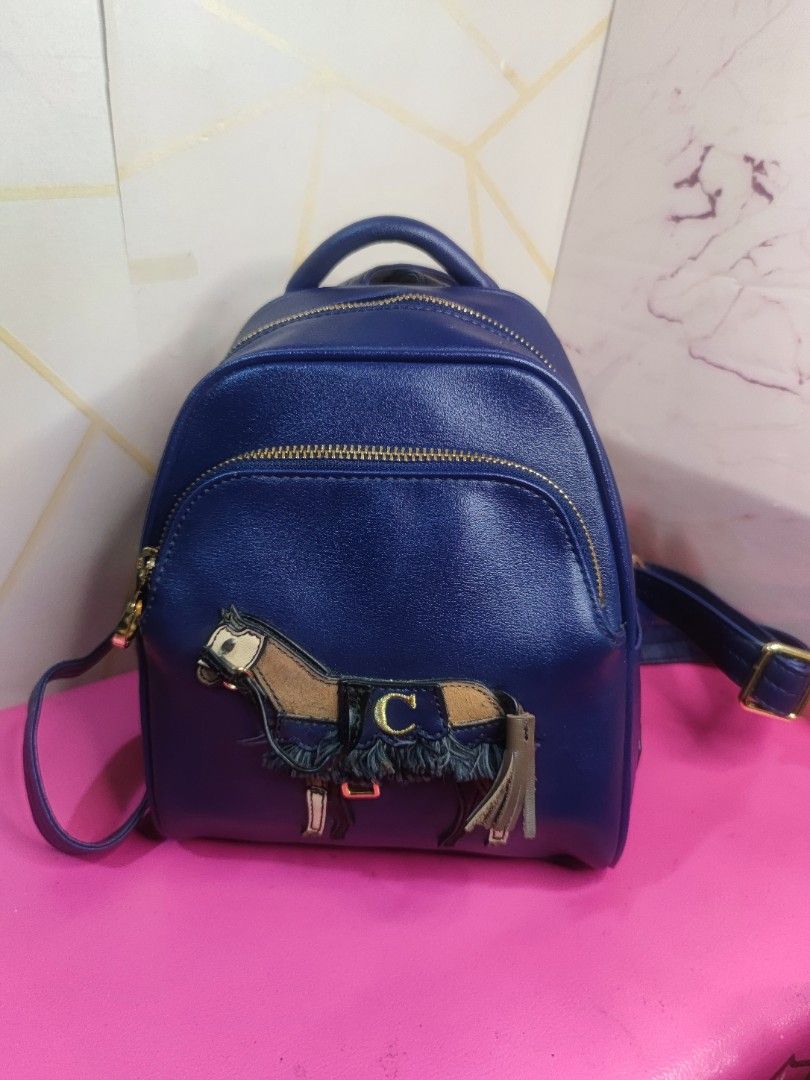 Lapalette Cupcake Blue Sparkly Mini Backpack with Horse Design (Category: Backpacks) located in Dagupan City. Submitted by jhazrightshop (Listing ID 1440429997, Image 1). Description: - Cute blue sparkly mini backpack - Features a horse design with fringe details - Gold zippers and hardware - Adjustable straps for a comfortable fit - Ideal for everyday use or as a fun accessory - Approximately 9 inches tall.