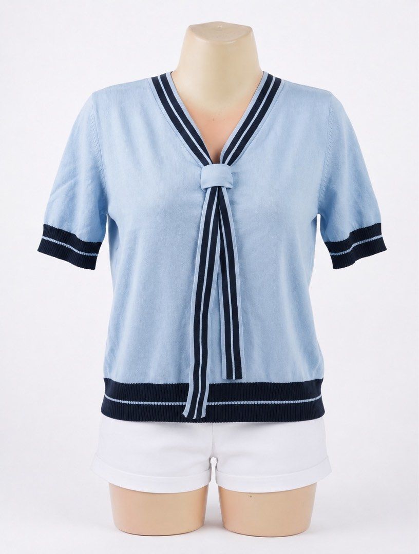 Light Blue Sailor Collar Knit Top with Navy Trim (Category: Blouses) located in Baliuag. Submitted by euphoriatees (Listing ID 1440414796, Image 1). Description: - Light blue knit top - Sailor collar with navy blue trim - Short sleeves with navy cuffs - Ribbed hem with navy trim - Navy ribbon neck tie - Ideal for a casual, preppy look -Size: Small to Medium Frame.