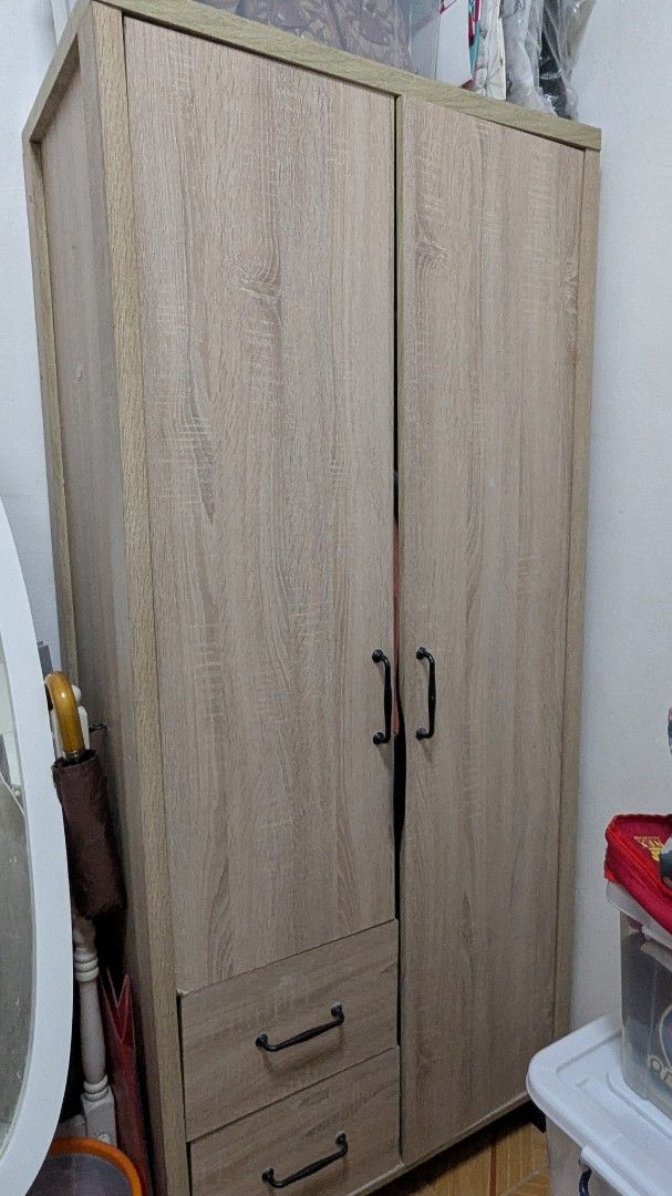 Light Wood 2-Door Wardrobe with Drawers (Category: Shelves, Cabinets & Racks) located in Cavite. Submitted by jaimosh (Listing ID 1440563413, Image 1). Description: - Light wood finish wardrobe - Features two doors for easy access - Two spacious drawers at the bottom for extra storage - Stylish black handles - Plenty of internal space for clothes and other items - Dimensions: 31.5x18x67.5 in inches - Pick up only.