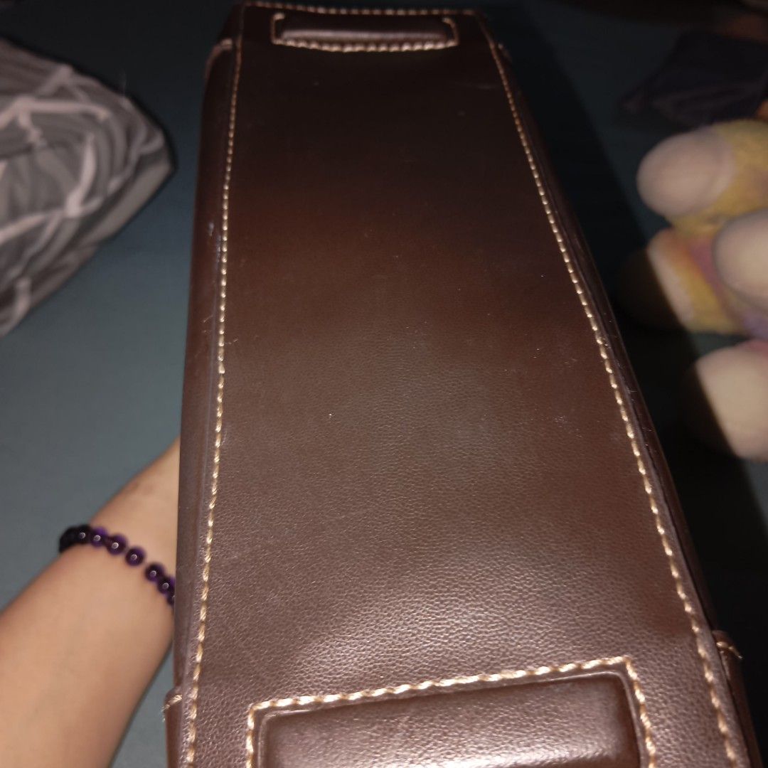 Liz Claiborne Brown Shoulder Bag (Category: Shoulder Bags) located in Mandaluyong City. Submitted by ilightcoproducts (Listing ID 1440509415, Image 3). Description: - Liz Claiborne shoulder bag - Color: Brown - Closure: Flap with silver-tone clasp - Interior: Houndstooth lining with zippered pocket - Material: Leather - Features: Shoulder strap, reinforced corners.