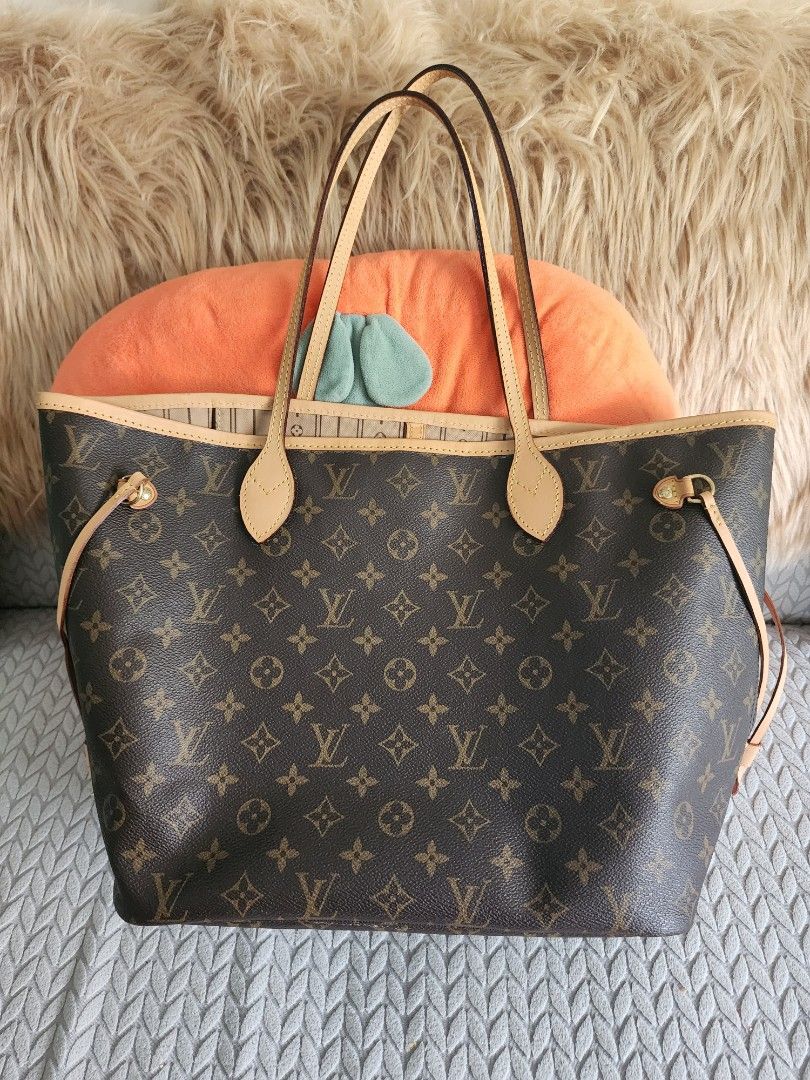 Louis Vuitton Monogram Canvas Tote Bag with dust bag. change vancheta (Category: Luxury Bags & Wallets) located in Quezon City. Submitted by deng43763 (Listing ID 1440395231, Image 1). Description: - Classic Louis Vuitton Monogram tote bag - Durable monogram canvas exterior - Interior lining with LV pattern - Includes a detachable pouch - Genuine leather trim and handles - Ideal for everyday use - Ample interior space.