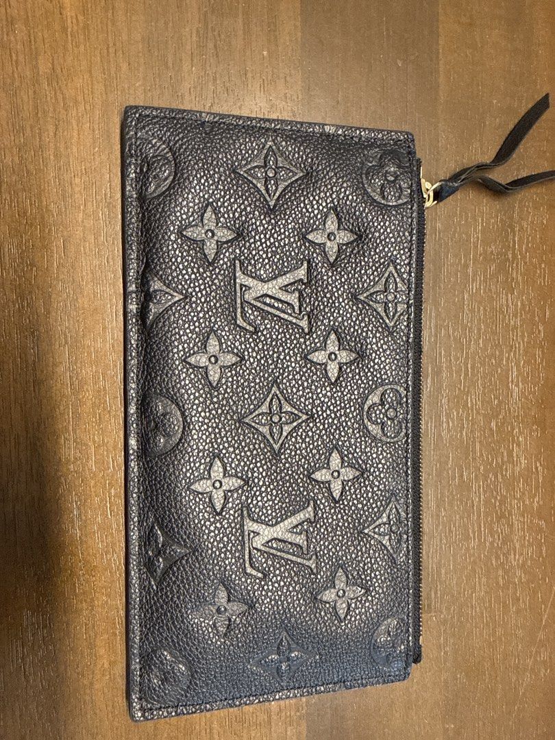 Louis Vuitton Monogram Empreinte Long Wallet (Category: Bags & Wallets) located in Singapore. Submitted by csjsherlyn (Listing ID 1440468212, Image 1). Description: - Authentic Louis Vuitton Wallet - Color: Black - Material: Monogram Empreinte Leather - Closure: Zip with leather pull tab - Features: Ample space for cards and cash - Ideal for: Everyday use - only wallet .