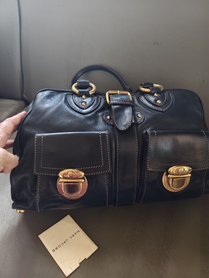 Marc Jacobs Black Leather Satchel Bag Gold Hardware (Category: Luxury Bags & Wallets) located in Catbalogan. Submitted by jncetpangz (Listing ID 1440453554, Image 2). Description: - Brand: Marc Jacobs - Genuine Black Leather - Hardware: Gold-tone - Riri Zip - Features: Front pockets with clasp closures, top handles, zip closure - Includes: Small tag - Style: Satchel bag - Ideal for: Everyday use pwede po mag ask ngpicture para sa bag..