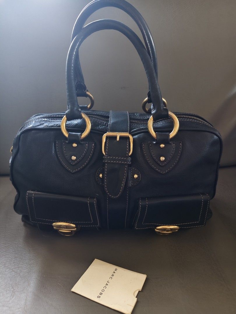 Marc Jacobs Black Leather Satchel Bag Gold Hardware (Category: Luxury Bags & Wallets) located in Catbalogan. Submitted by jncetpangz (Listing ID 1440453554, Image 1). Description: - Brand: Marc Jacobs - Genuine Black Leather - Hardware: Gold-tone - Riri Zip - Features: Front pockets with clasp closures, top handles, zip closure - Includes: Small tag - Style: Satchel bag - Ideal for: Everyday use pwede po mag ask ngpicture para sa bag..