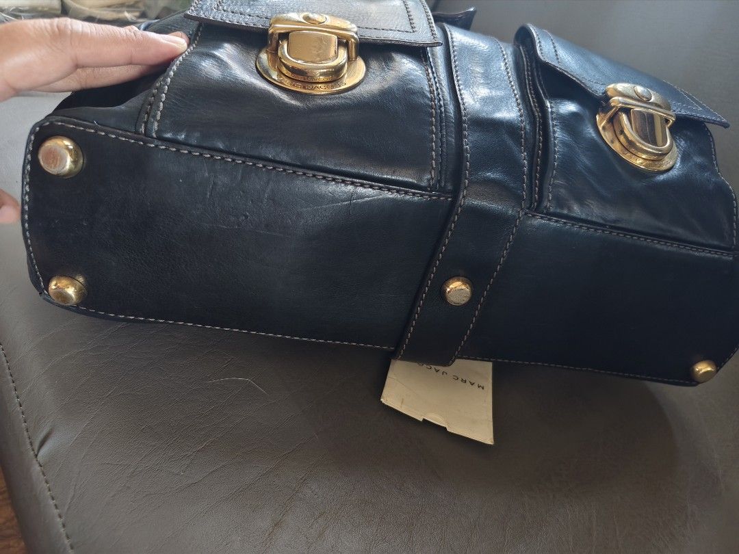 Marc Jacobs Black Leather Satchel Bag Gold Hardware (Category: Luxury Bags & Wallets) located in Catbalogan. Submitted by jncetpangz (Listing ID 1440453554, Image 3). Description: - Brand: Marc Jacobs - Genuine Black Leather - Hardware: Gold-tone - Riri Zip - Features: Front pockets with clasp closures, top handles, zip closure - Includes: Small tag - Style: Satchel bag - Ideal for: Everyday use pwede po mag ask ngpicture para sa bag..