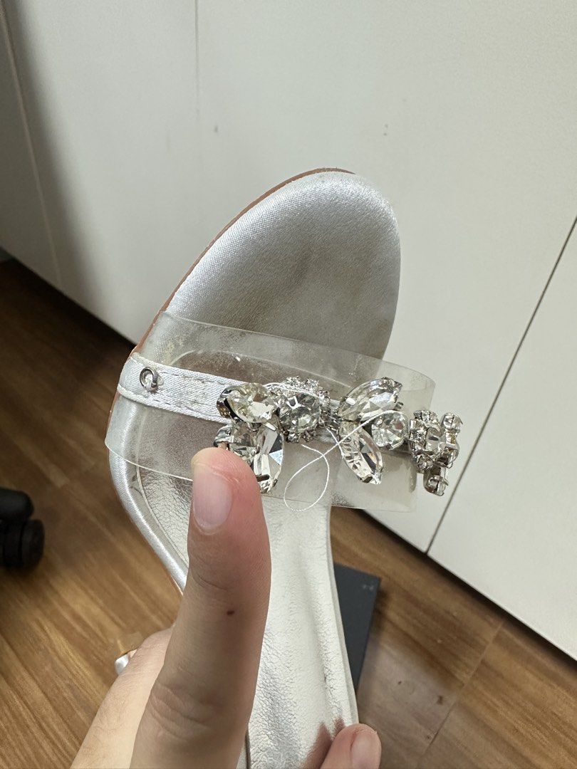 Matthes White Embellished Heels with Ankle Strap (Category: Heels) located in Bulacan. Submitted by elyjgpreloved (Listing ID 1440442238, Image 3). Description: Used twice. My wedding and abay. Na loose thread lang kasi sumabit sa gown ko nung abay ako. - White heels with sparkly embellishments on the strap - Secure ankle strap for a comfortable fit - Sole shows some signs of wear - Includes original box - Size 36.