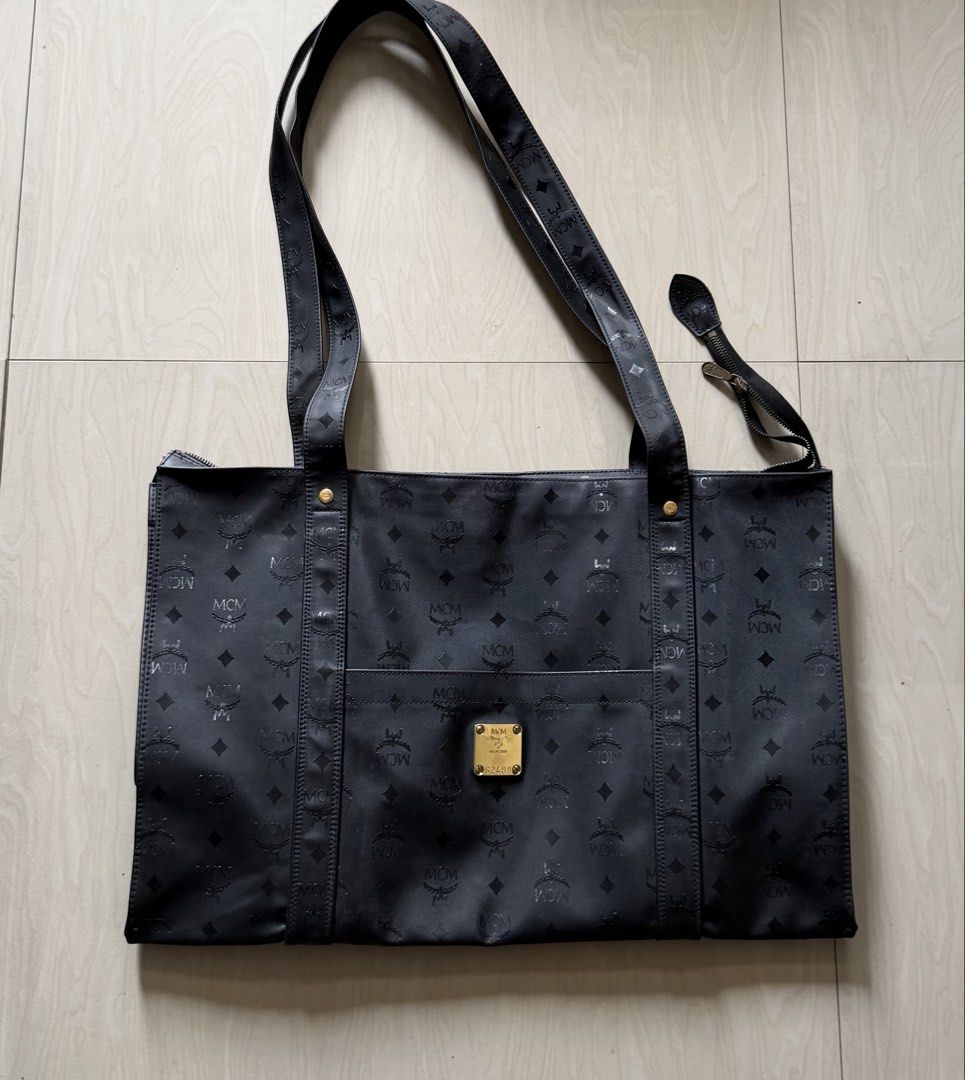 MCM Monogram Tote Bag Black (Category: Luxury Bags & Wallets) located in Quezon City. Submitted by megchrisanne (Listing ID 1440447145, Image 1). Description: MCM TRAVELLING BAG NO INCLUSION LARGE-XL SIZE IN EXCELLENT 9/10 CONDITION FIRST TO PAY BDO/GCASH PAYMENT LBC/LALAMOVE COURIER.