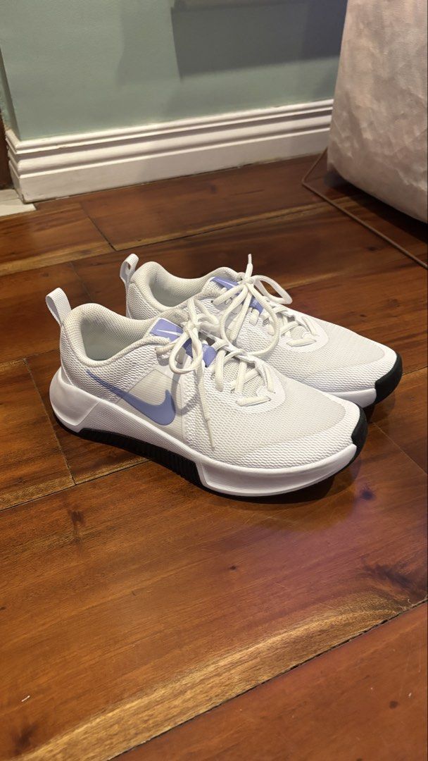 Nike MC Trainer 3 Metcon (Category: Sneakers) located in Muntinlupa City. Submitted by sehbulok (Listing ID 1440467922, Image 1). Description: - White Nike sneakers - Lavender swoosh detail - Lace-up closure - Breathable mesh upper - Durable rubber outsole for grip - Size: EU 39 / US Women's 8.5 - Ideal for workouts and casual wear - Like new used less than 10 times - No box included.