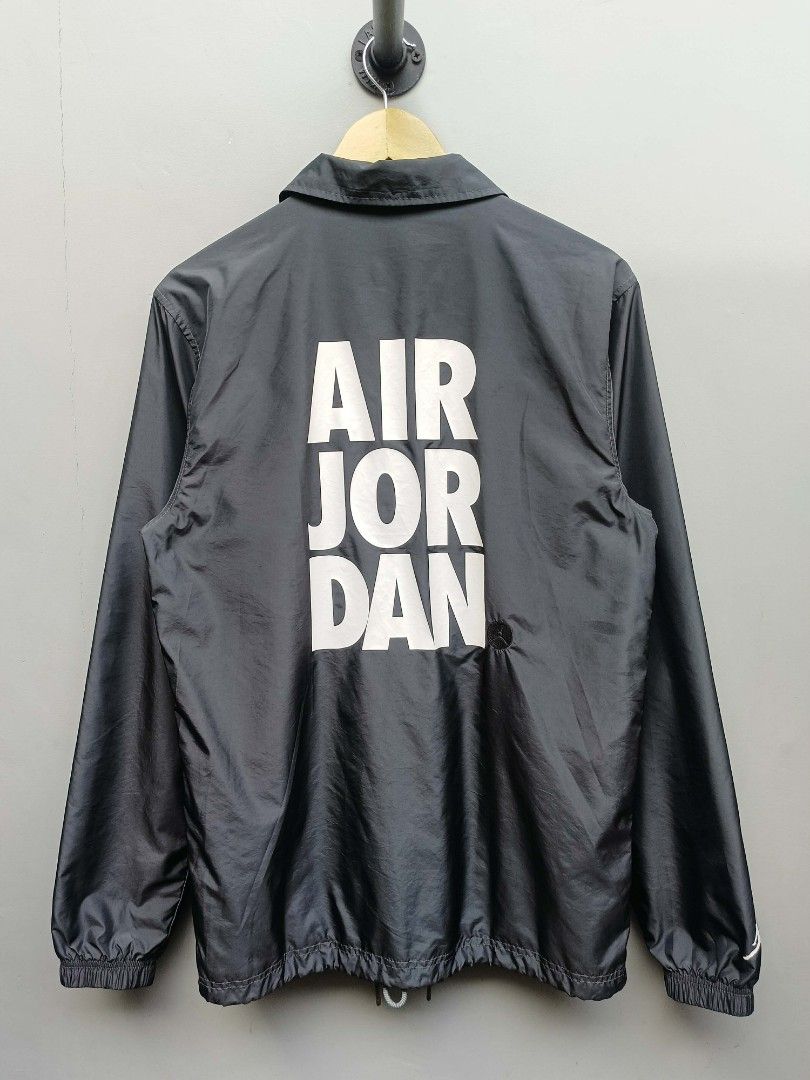 Nike x Jordan Smoke Gray Classic Coach Jacket (Category: Coats, Jackets and Outerwear) located in Taguig. Submitted by _theroom.ph (Listing ID 1440484500, Image 3). Description: - Grey Jordan coach jacket - Features Jumpman logo on front - "AIR JORDAN" graphic on back - Standard fit - Lightweight material - Button-up front with pockets - Made in Vietnam Nike x Jordan Smoke Gray Classic Coach Jacket Size XS Fits Medium 28 x 20.5 Excellent Conditio
