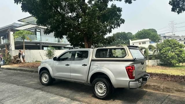 Nissan Navara EL 4x2 Manual (Category: Used Cars) located in Pasig City. Submitted by calmdragon (Listing ID 1440464753, Image 3). Description: 1st Owner Nissan Navara EL 2023 2.5 Diesel Engine 4x2 6speed Manual Transmition With Camper Shell 53,000 km reading P750,000 Message for contact.