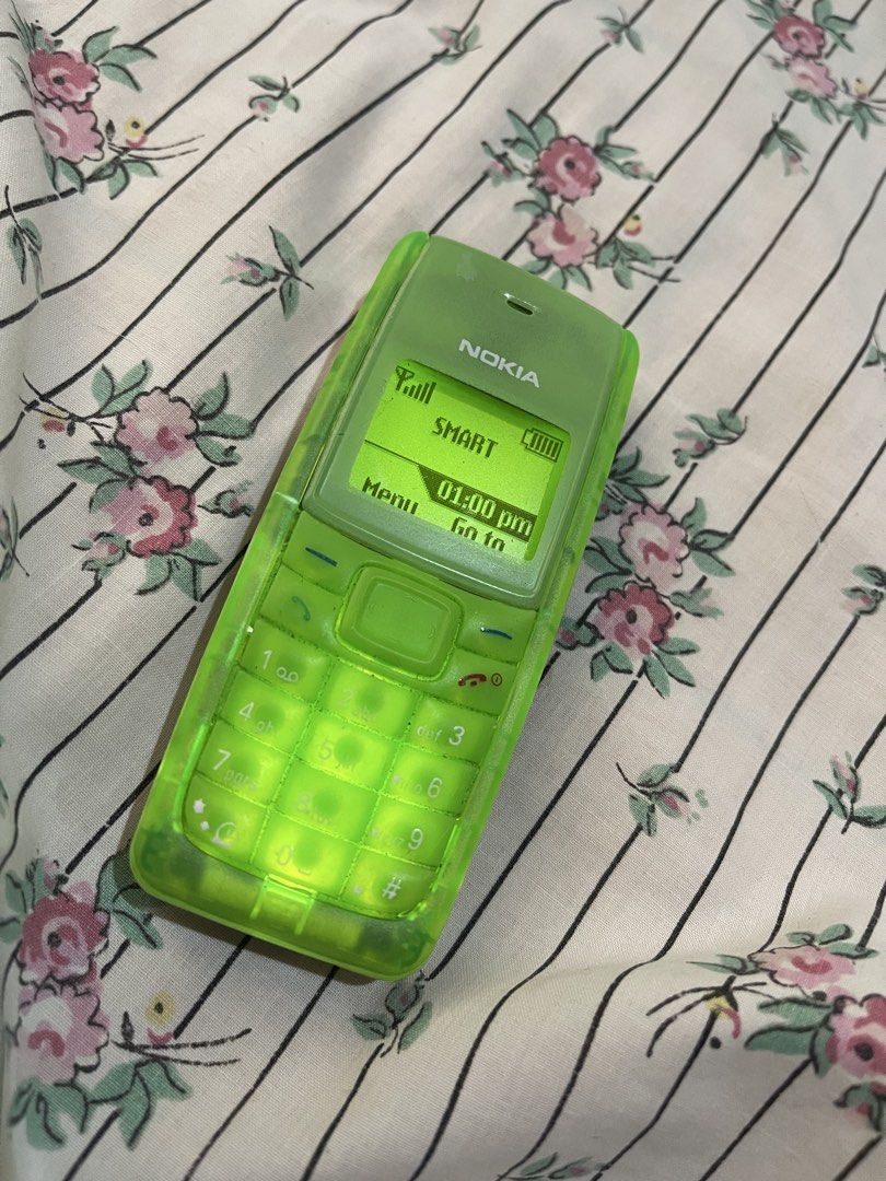 Nokia 1110i in green color (Category: Early Generation Mobile Phones) located in Quezon City. Submitted by foreign.oy (Listing ID 1440431261, Image 1). Description: Classic Nokia phone in vibrant green - openline - Simple and reliable for calls and texts - Long-lasting battery life - Easy-to-use keypad - housing and bone has been newly replaced - Ideal for basic phone needs, as a backup Unit and replacement charger shipping via lalamove or LBC fo