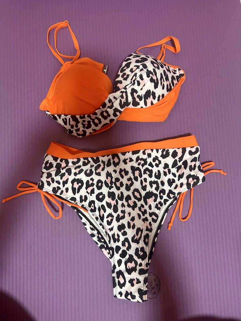 Orange Leopard Print High Waisted Bikini Set (Category: Bikinis & Swimsuits) located in Caloocan City. Submitted by decluttervette (Listing ID 1440395855, Image 1). Description: Never worn Size large but fits large to xl Rfs: Bigger size, not fitted.