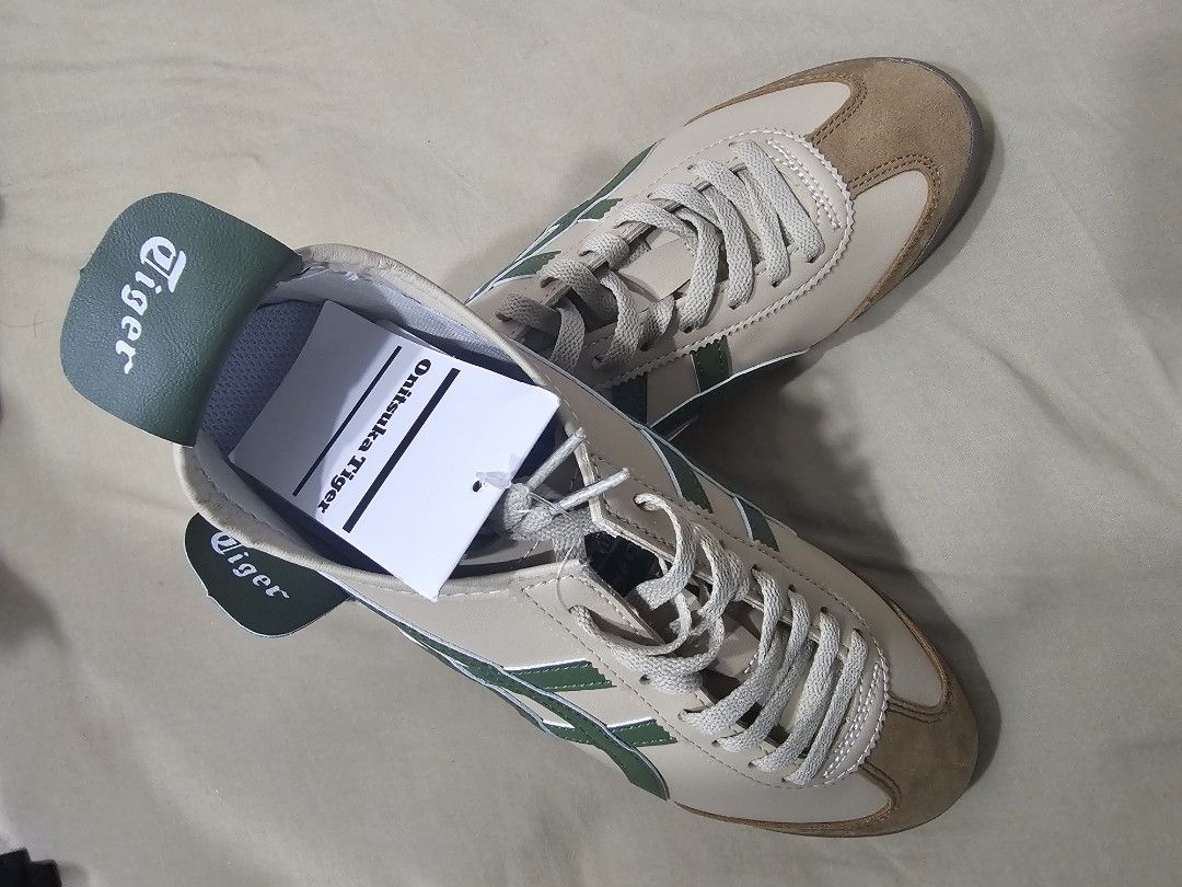 Original Onitsuka Tiger Mexico 66 Beige Green Sneakers (Category: Sneakers) located in Singapore. Submitted by sky. (Listing ID 1440550853, Image 2). Description: - Classic Onitsuka Tiger Mexico 66 - Color: Beige with green stripes - Features suede toe cap and heel accent - Lace-up closure - Size: 43.5 EU / 9.5 US / 27.5 CM - Perfect for casual everyday wear - New Colour Design Original from Japan. Sincere Buyer Only. Bought wrong size that why s