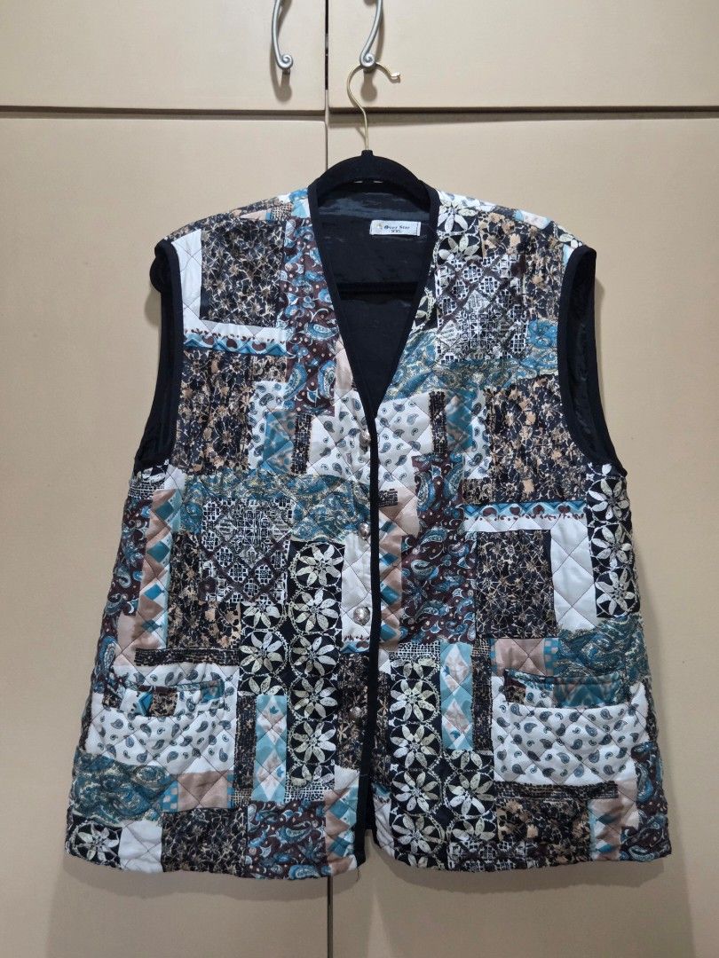 Over Star Quilted Patchwork Style Vest (Category: Vests) located in Quezon City. Submitted by chillisauce_ (Listing ID 1440448234, Image 1). Description: - Length 27 in., Width 23 in., Armhole 10 in. - Quilted vest with unique patchwork design - Black trim and decorative silver buttons - Black inner lining - Size XXL - Ideal for layering.
